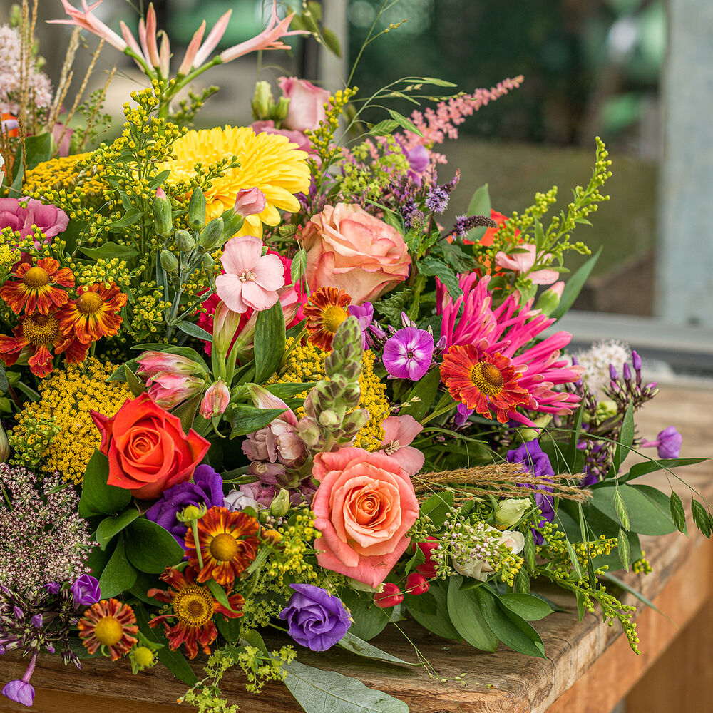 Green approved colorful funeral arrangement